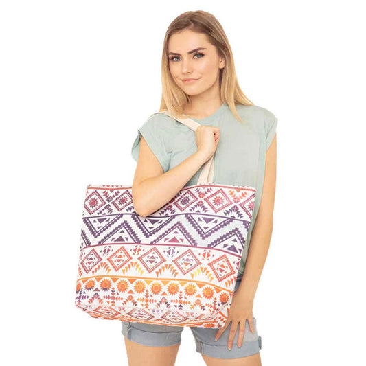 Navy Colorful Tribal Pattern Beach Tote Bag. Show your trendy side with this awesome Tribal Pattern beach tote bag. Spacious enough for carrying any and all of your seaside essentials. The straps helps carrying this shoulder bag comfortably. Perfect as a beach bag to carry foods, drinks, big beach blanket, towels, swimsuit, toys, flip flops, sun screen and more. 