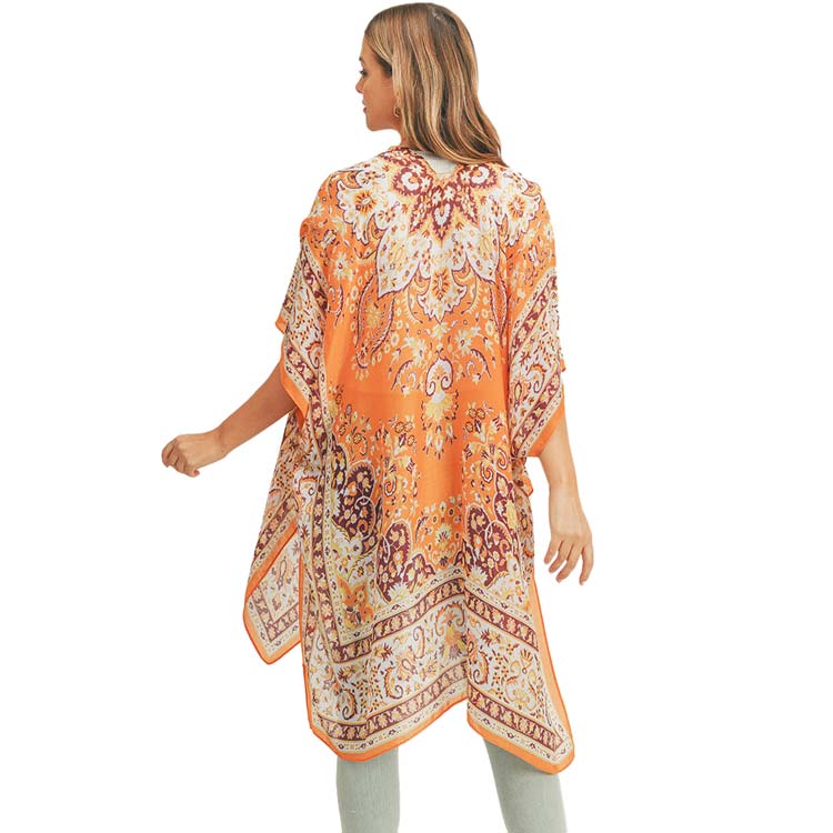 Orange Patterned Cover Up Kimono Poncho, Absolutely fab for this summer & spring season to amp up your attire & make you comfortable in dressing up. These kimonos feature a beautiful pattern that is easy to pair with so many tops. 