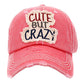 Pink Cute But Crazy Message Camouflage Vintage Baseball Cap. This adorable and classic cap combines both colourful styles to turn your head and comfort for your all-day wear. perfect to keep your hair away from you face while exercising, running, playing tennis or just taking a walk outside. Adjustable Velcro strap gives you the perfect fit.
