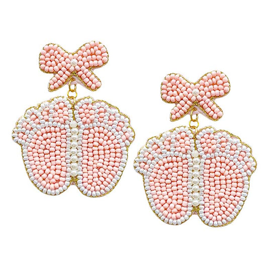 Pink Felt Back Pearl Beaded Bow Baby Foot Dangle Earrings, these fun-crafted baby foot dangle earrings are a sign of fashion trends, styles, and innovations. These beautiful pearl beaded earrings are gorgeous and unique that will dangle on your earlobes to make you stand out from the crowd. These pearl earrings will dangle on your earlobes to show the perfect class and make others smile with joy.