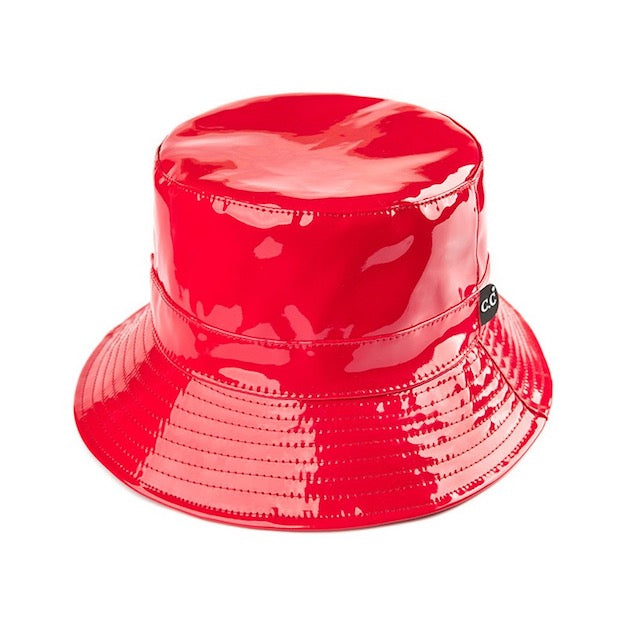 Red C.C Brand Shiny Solid Color Reflective Enamel Detailed Rain Bucket Hat; this rain hat is snug on the head and works well to keep rain off the head, out of eyes, and also the back of the neck. Wear it to lend a modern liveliness above a raincoat on trans-seasonal days in the city. Perfect Gift for fashion-forward friend