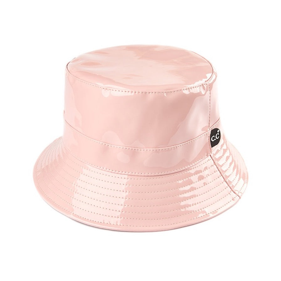 Rose C.C Brand Shiny Solid Color Reflective Enamel Detailed Rain Bucket Hat; this rain hat is snug on the head and works well to keep rain off the head, out of eyes, and also the back of the neck. Wear it to lend a modern liveliness above a raincoat on trans-seasonal days in the city. Perfect Gift for fashion-forward friend