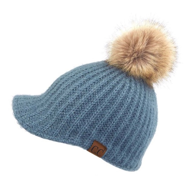 Steel Blue C.C Cable Knitted Brim Beanie Natural Faux Fur Pom Pom Warm Winter Hat; reach for this classic toasty hat to keep you nice and warm in the chilly winter weather, the wintry touch finish to your outfit. Perfect Gift Birthday, Christmas, Holiday, Anniversary, Stocking Stuffer, Secret Santa, Valentines Day, Loved One, BFF