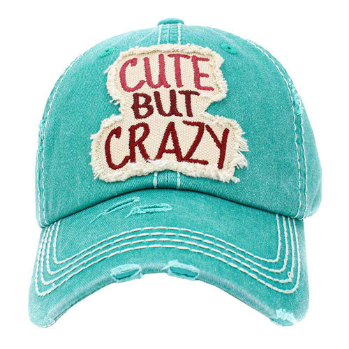 Turquoise Cute But Crazy Message Camouflage Vintage Baseball Cap. This adorable and classic cap combines both colourful styles to turn your head and comfort for your all-day wear. perfect to keep your hair away from you face while exercising, running, playing tennis or just taking a walk outside. Adjustable Velcro strap gives you the perfect fit.