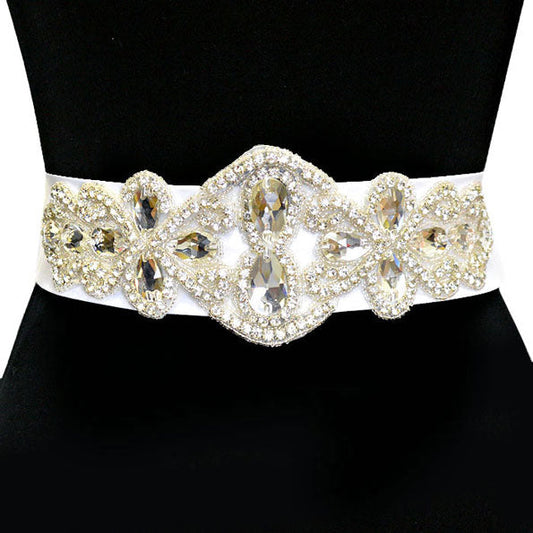 White Bridal Crystal & Bead Ribbon Belt. A timeless selection, this Crystal  Belt is exceptionally elegant, adding an exquisite detail to your wedding dress or tie it on your hair for a glamorous, beautiful self tie headband elevating your hairstyle on your super special day. Crystal applique is placed delicately on white organza ribbon, long enough to fit comfortably around your waist.