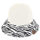White C.C Zebra Print Cloche Straw Bucket Hat. Keep your styles on even when you are relaxing at the pool or playing at the beach. Large, comfortable, and perfect for keeping the sun off of your face, neck, and shoulders Perfect summer, beach accessory. Ideal for travelers who are on vacation or just spending some time in the great outdoors.