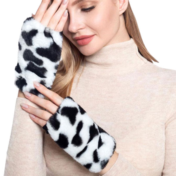 White Cow Patterned Faux Fur Fingerless Gloves. Before running out the door into the cool air, you’ll want to reach for these toasty gloves to keep your hands incredibly warm. Accessorize the fun way with these gloves, it's the autumnal touch you need to finish your outfit in style. Awesome winter gift accessory!
