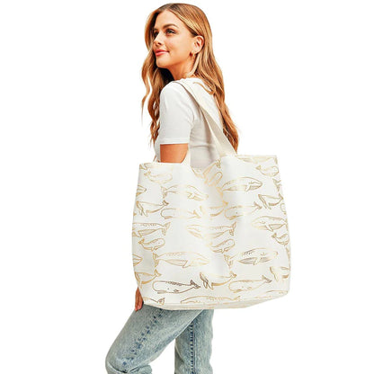 White Metallic Whale Beach Tote Bag, going to the pool or beach, this Whale print tote bag is the perfect accessory. Spacious enough for carrying any and all of your seaside essentials. The soft rope straps really help carry this tie due shoulder bag comfortably. Perfect for carrying books, as a laptop bag, beach carry, or even an everyday bag!
