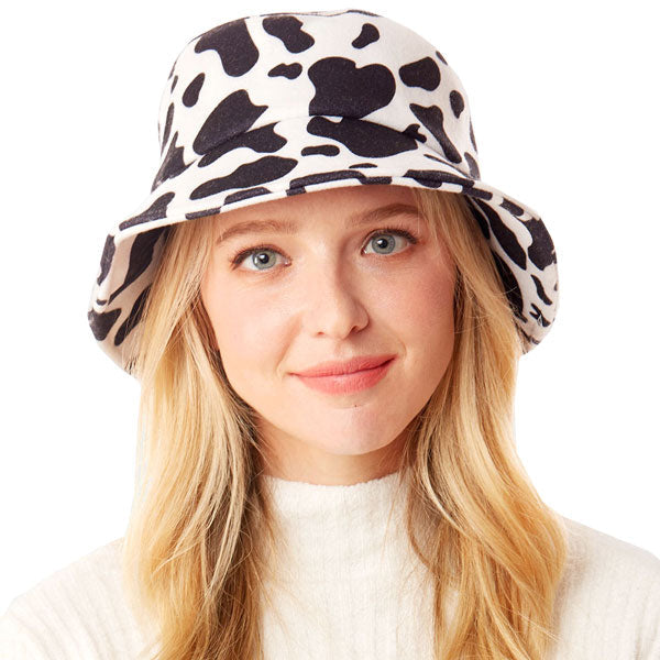 White Polyester One Size Cow Patterned Bucket Hat. Show your trendy side with this chic animal print hat. Have fun and look Stylish. Great for covering up when you are having a bad hair day, perfect for protecting you from the sun, rain, wind, snow, beach, pool, camping or any outdoor activities.