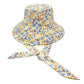 Yellow Flower Patterned Chin Tie Bucket Hat. Let your love for Summer bloom with these Bucket Hat. Packable and super convenient to carry, can also be easily carried inside your bags. Perfect for protecting you on a hot Summer day at the beach or keeping cool on the streets all while having your style completely intact!